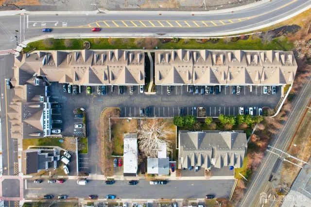 a front view of a building with retail shop and outdoor seating