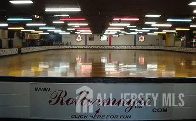 a kitchen with a sink and breakfast area