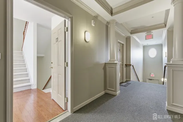 a view of a hallway with staircase
