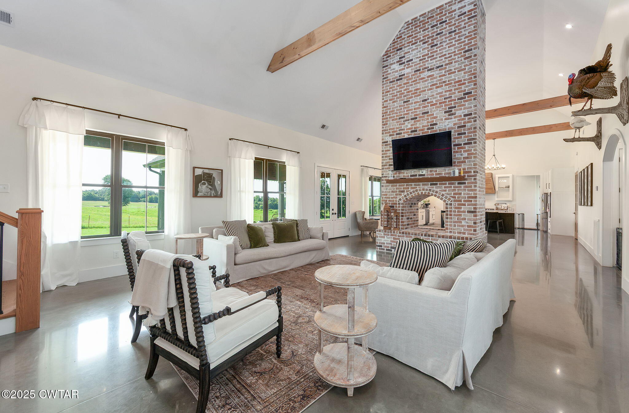 1644 Dr Conyers Road Friendship, TN 38034 - Photo 11 of 43 a living room with furniture a flat screen tv and a fireplace