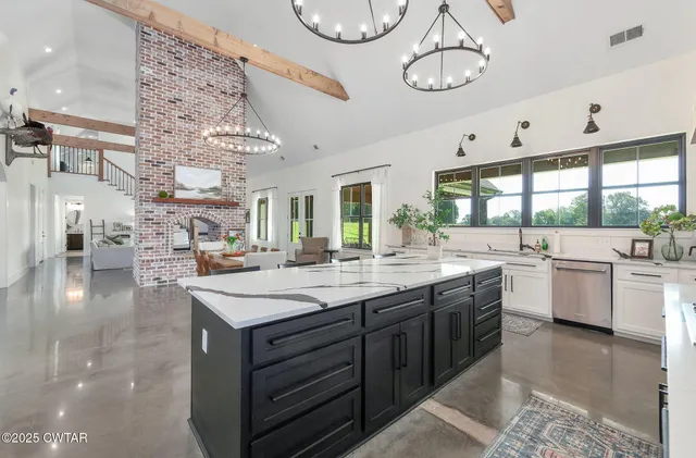 a view of a dining room with furniture and a window
