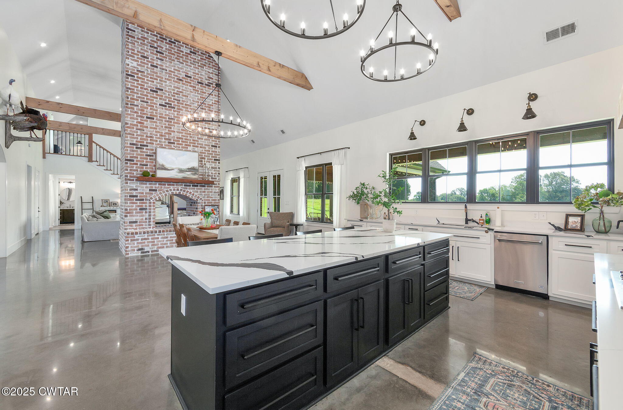 1644 Dr Conyers Road Friendship, TN 38034 - Photo 15 of 43 a large white kitchen with lots of counter space and painting on the wall
