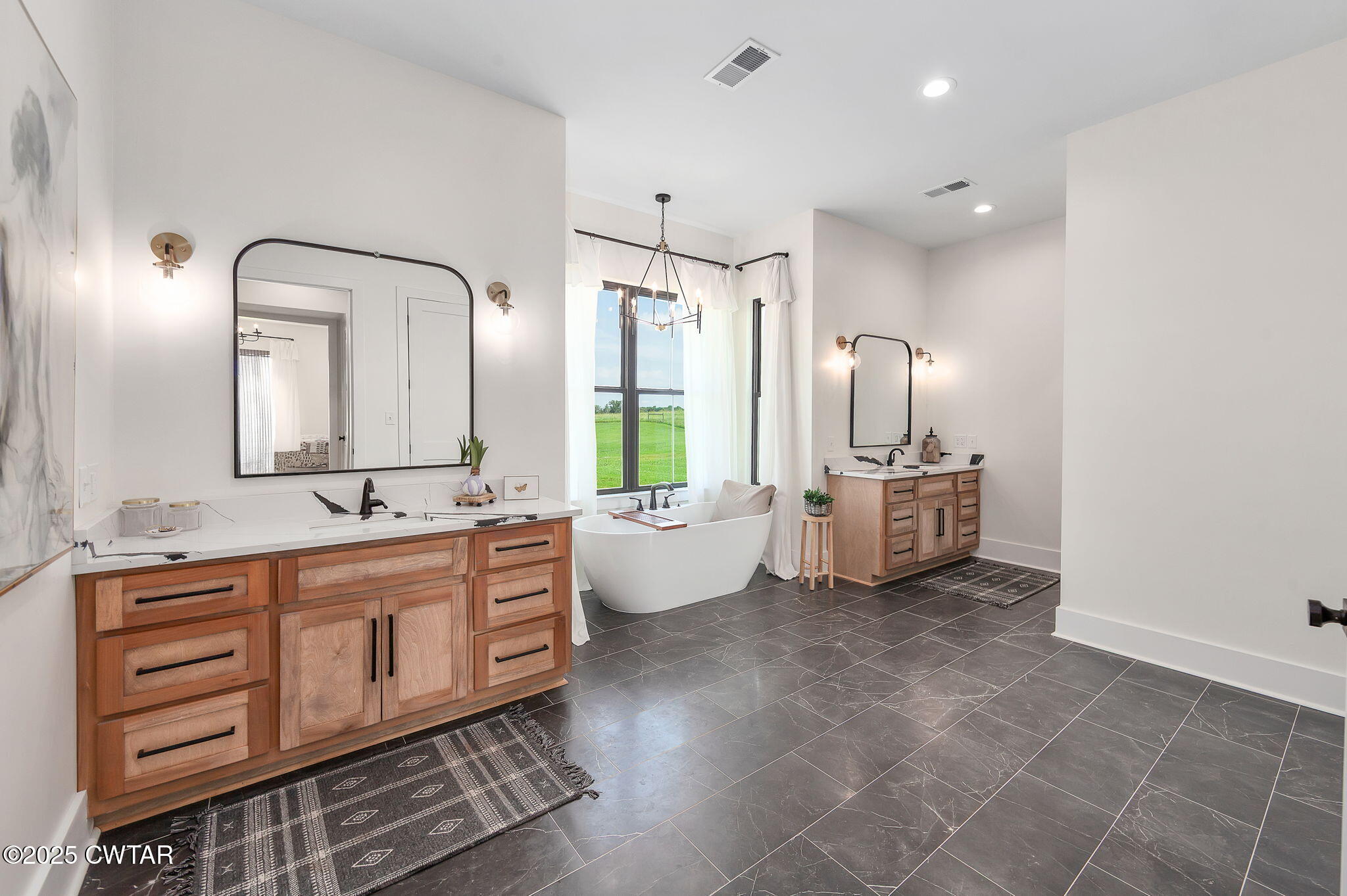1644 Dr Conyers Road Friendship, TN 38034 - Photo 22 of 43 a spacious bathroom with a double vanity sink a mirror and a bathtub