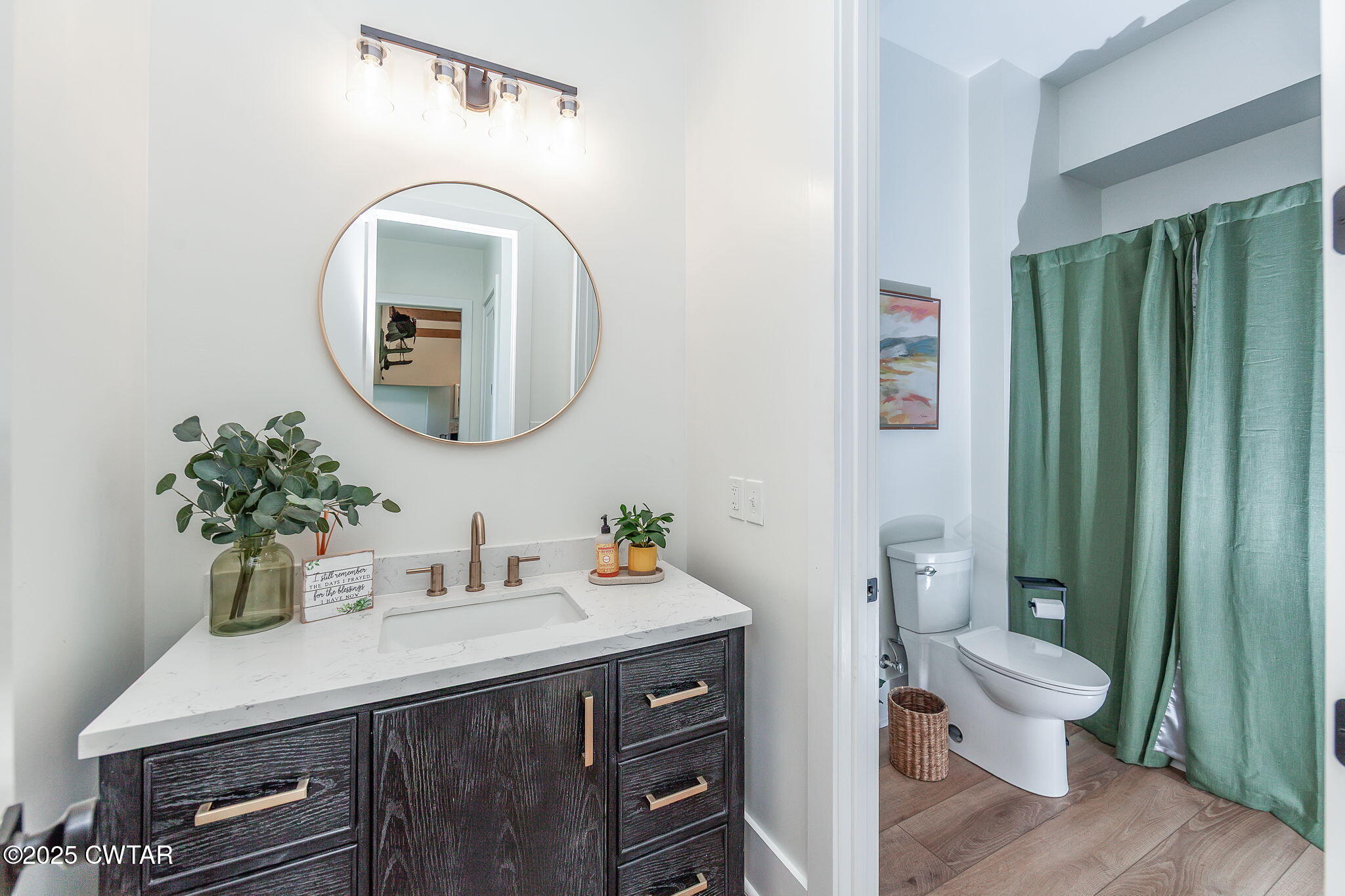 1644 Dr Conyers Road Friendship, TN 38034 - Photo 27 of 43 a bathroom with a sink a toilet and a mirror