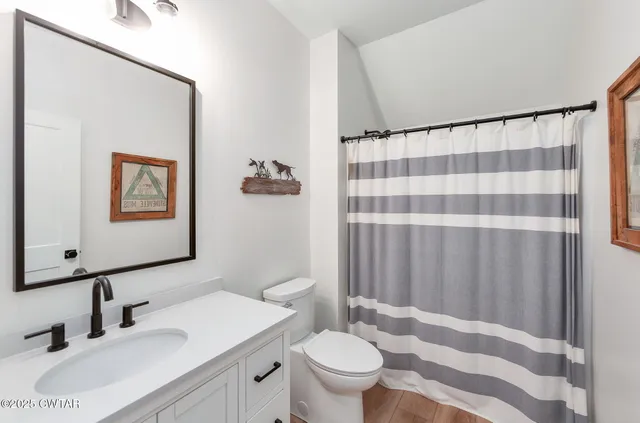 a bedroom with furniture and a chandelier