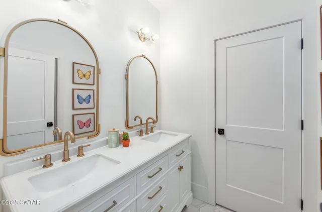 a hallway with a couch and a potted plant