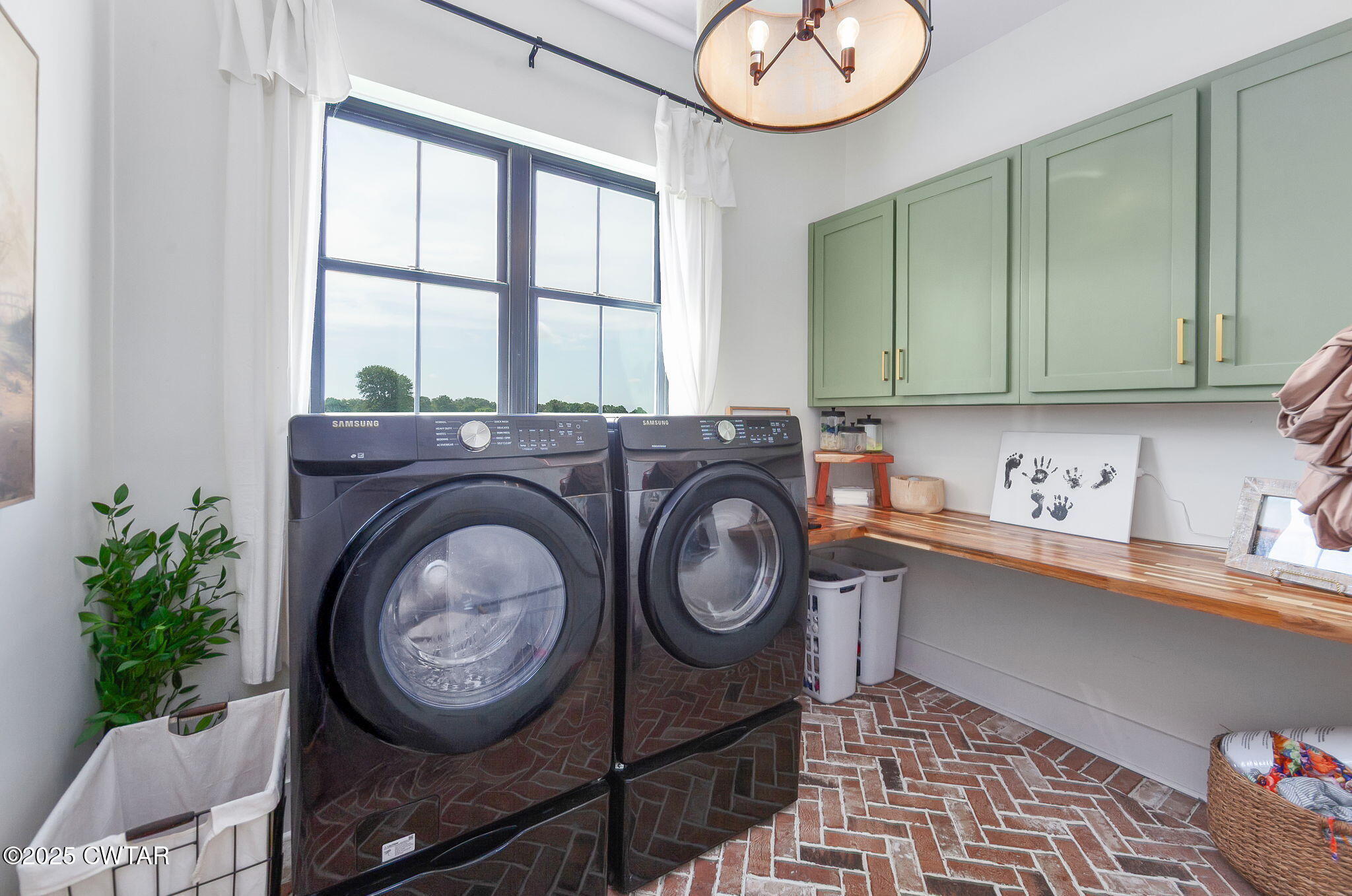 1644 Dr Conyers Road Friendship, TN 38034 - Photo 35 of 43 a view of a storage and utility room with washer and dryer