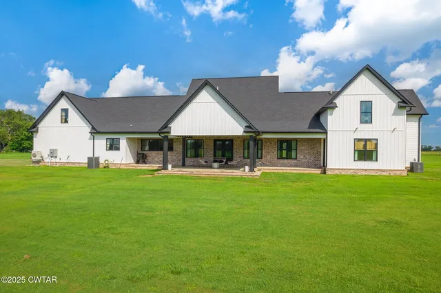a view of a big yard with swimming pool yard and outdoor seating