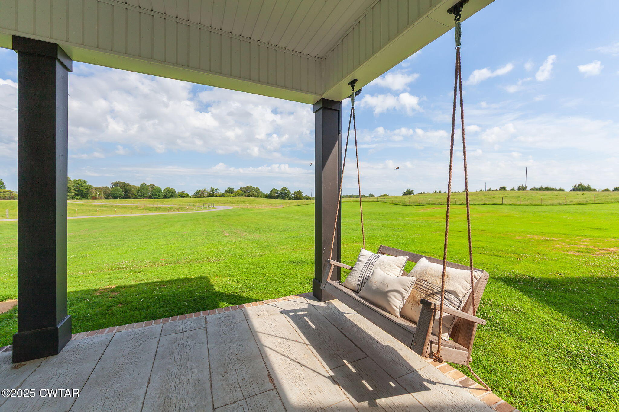 1644 Dr Conyers Road Friendship, TN 38034 - Photo 4 of 43 a view of a patio with lawn chairs and ocean view