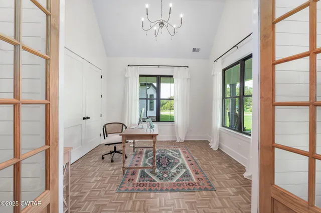 a living room with furniture and wooden floors