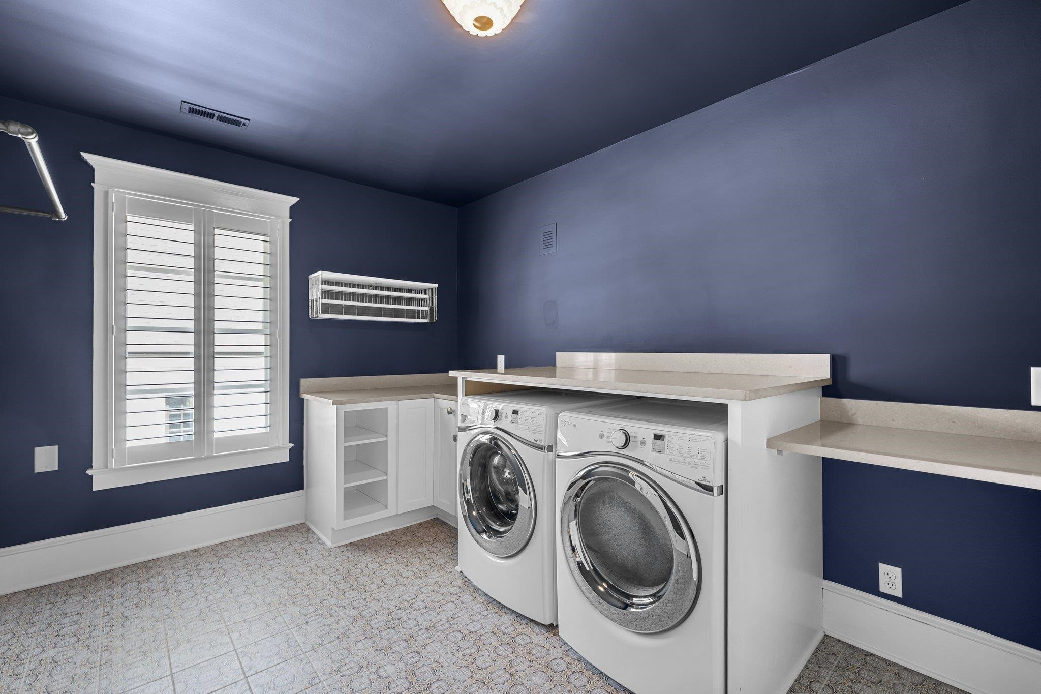 2116 Cowper Drive Raleigh, NC 27608 - Photo 54 of 65 This laundry room is a converted fourth bedroom and provides ample space to operate. Oversize Laundry Room