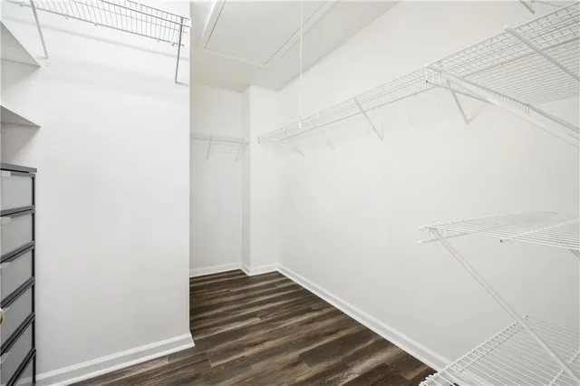a view of a room with wooden floor