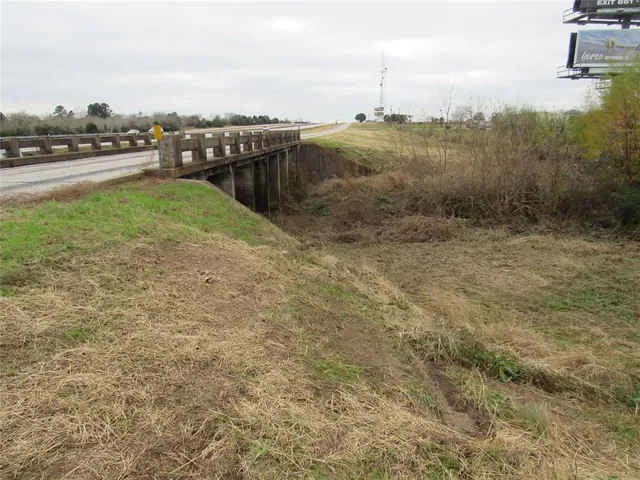 a view of a lake with a yard
