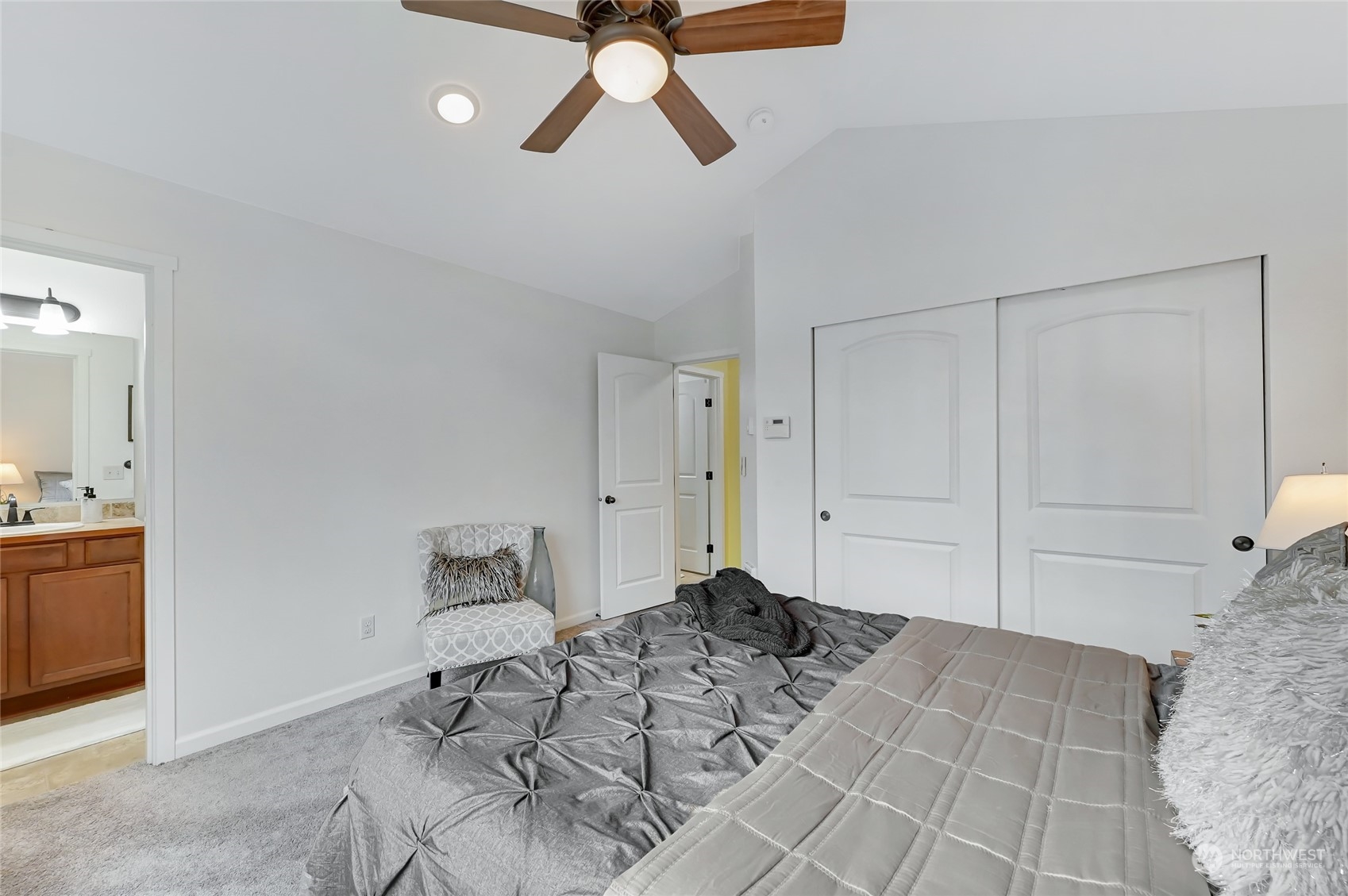 5027 Northeast 5th Place Renton, WA 98059 - Photo 16 of 29 a view of a bedroom with a bed and cabinet