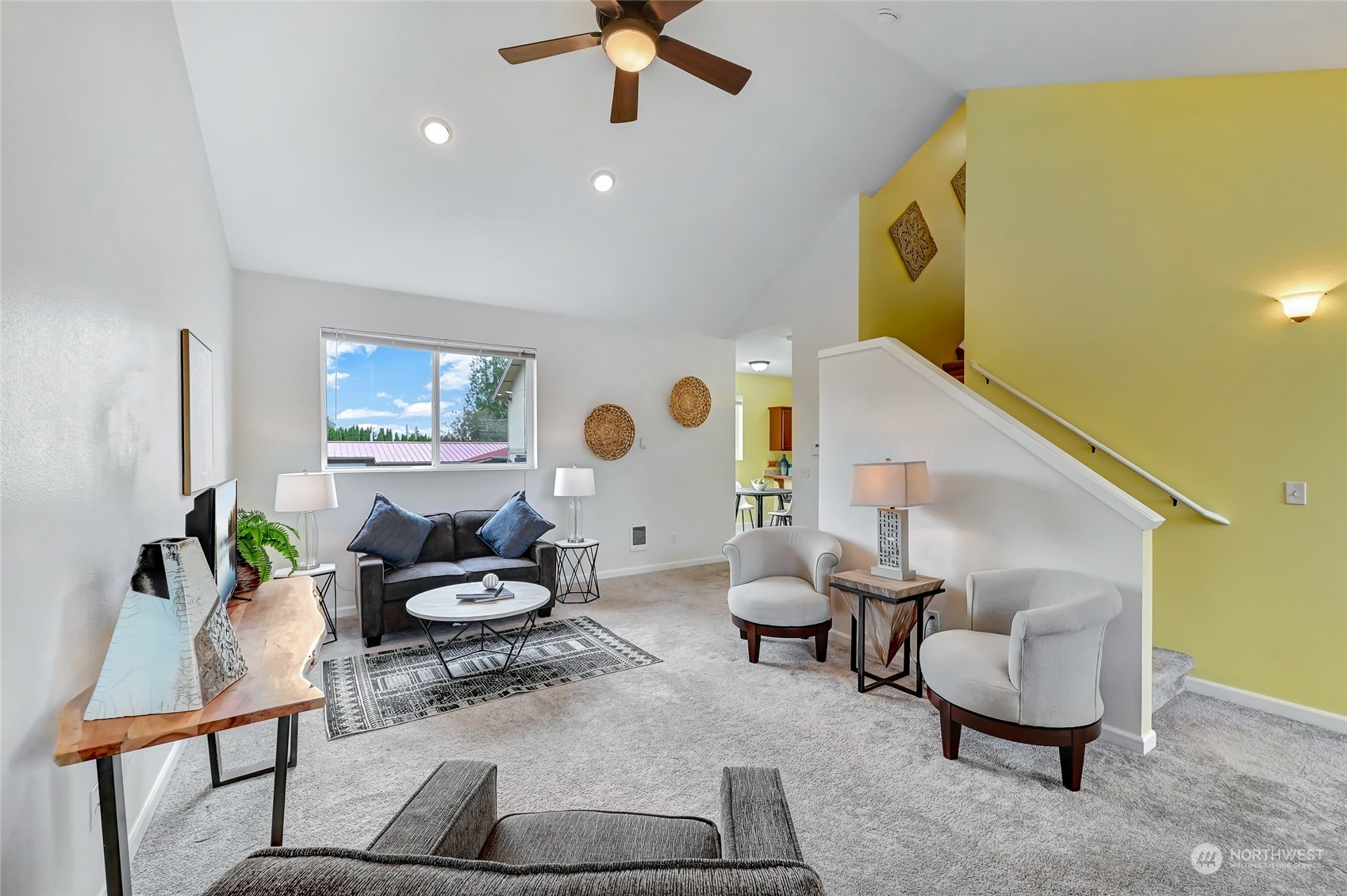 5027 Northeast 5th Place Renton, WA 98059 - Photo 6 of 29 a living room with furniture and a rug