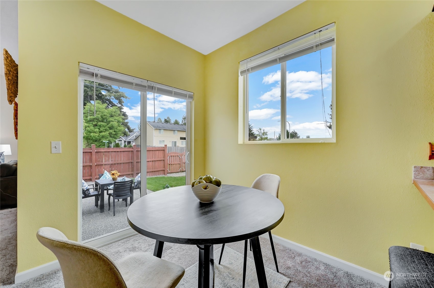 5027 Northeast 5th Place Renton, WA 98059 - Photo 9 of 29 a view of a dining room with furniture and a window