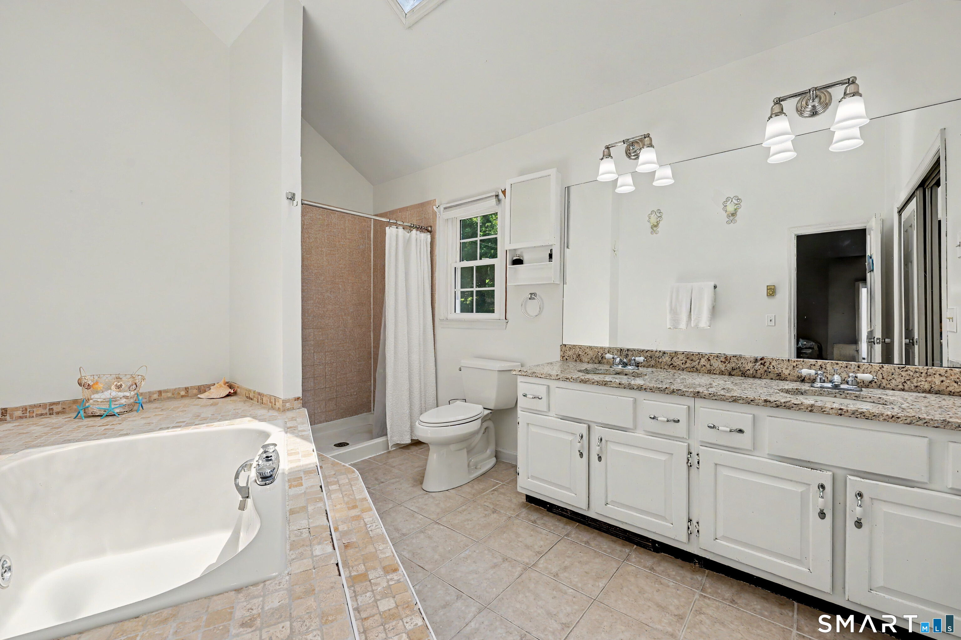29 Pleasant View Road New Milford, CT 06776 - Photo 24 of 40 Bathroom in primary bedroom with tub and separate shower