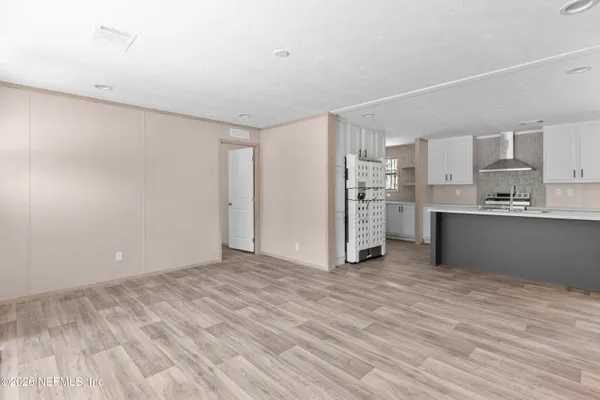 a view of kitchen with wooden floor
