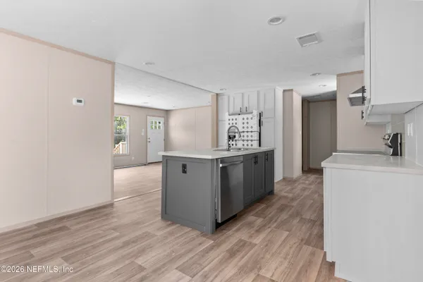 a kitchen with stainless steel appliances a refrigerator and a stove