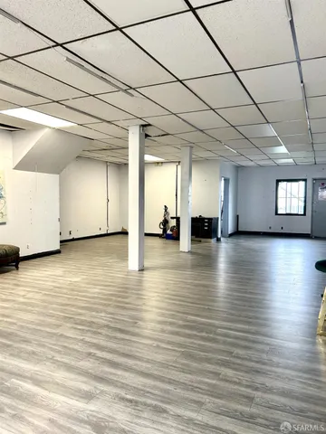 a view of a room with lots of wooden furniture