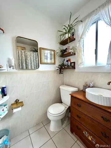 a kitchen with stainless steel appliances kitchen island granite countertop a sink a stove and a refrigerator