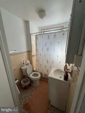 a bathroom with a sink and toilet