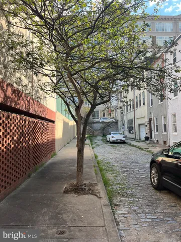 a view of street with parked cars
