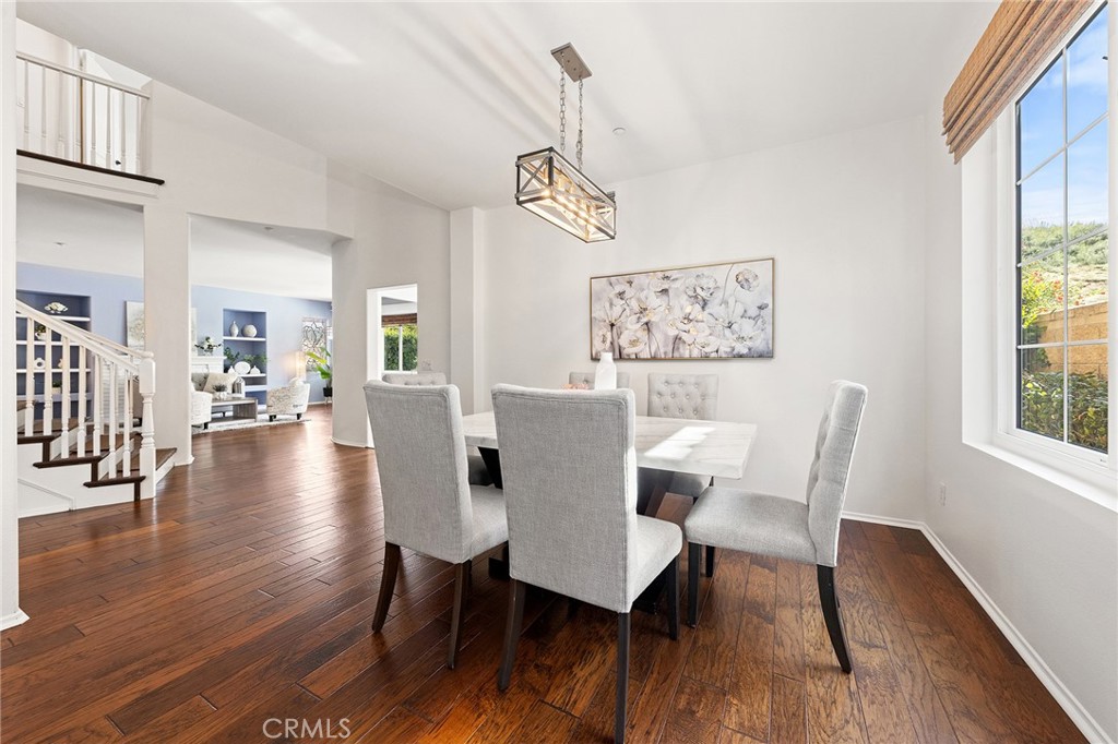 6133 Natalie Road Chino Hills, CA 91709 - Photo 13 of 62 a view of a dining room with furniture window and wooden floor