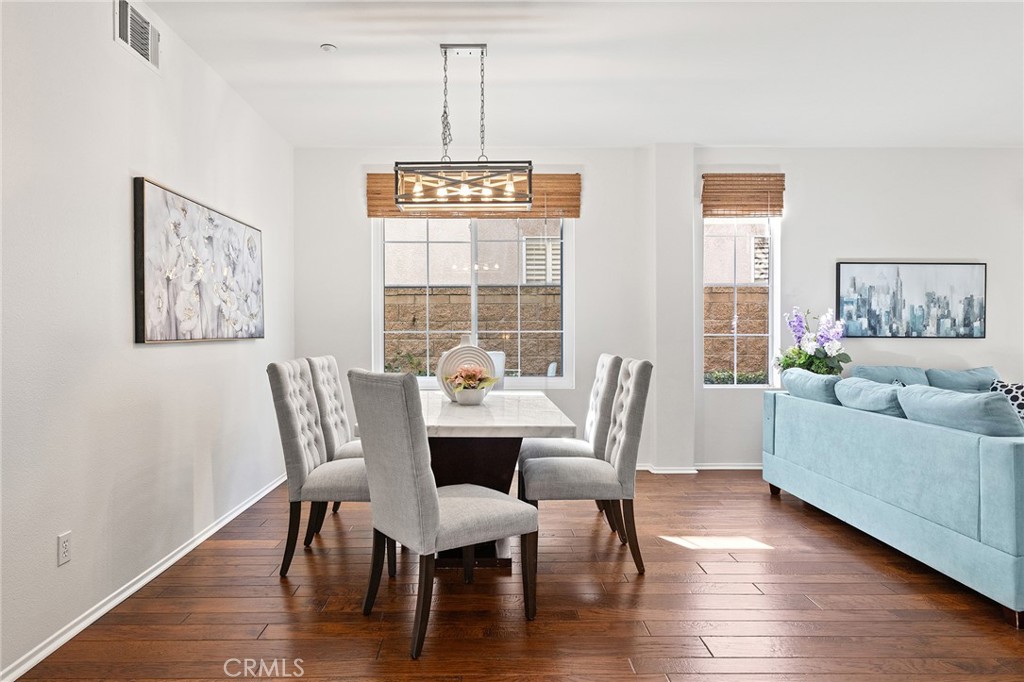 6133 Natalie Road Chino Hills, CA 91709 - Photo 14 of 62 a view of a dining room with furniture window and wooden floor