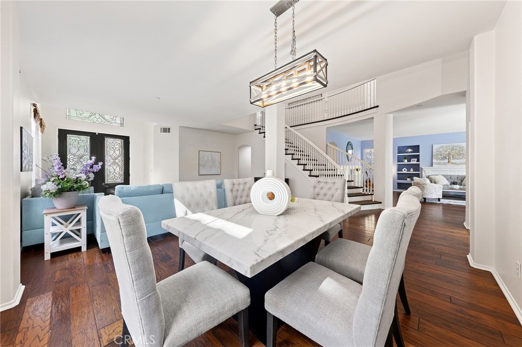 6133 Natalie Road Chino Hills, CA 91709 - Photo 15 of 62 a view of a dining room with furniture and wooden floor
