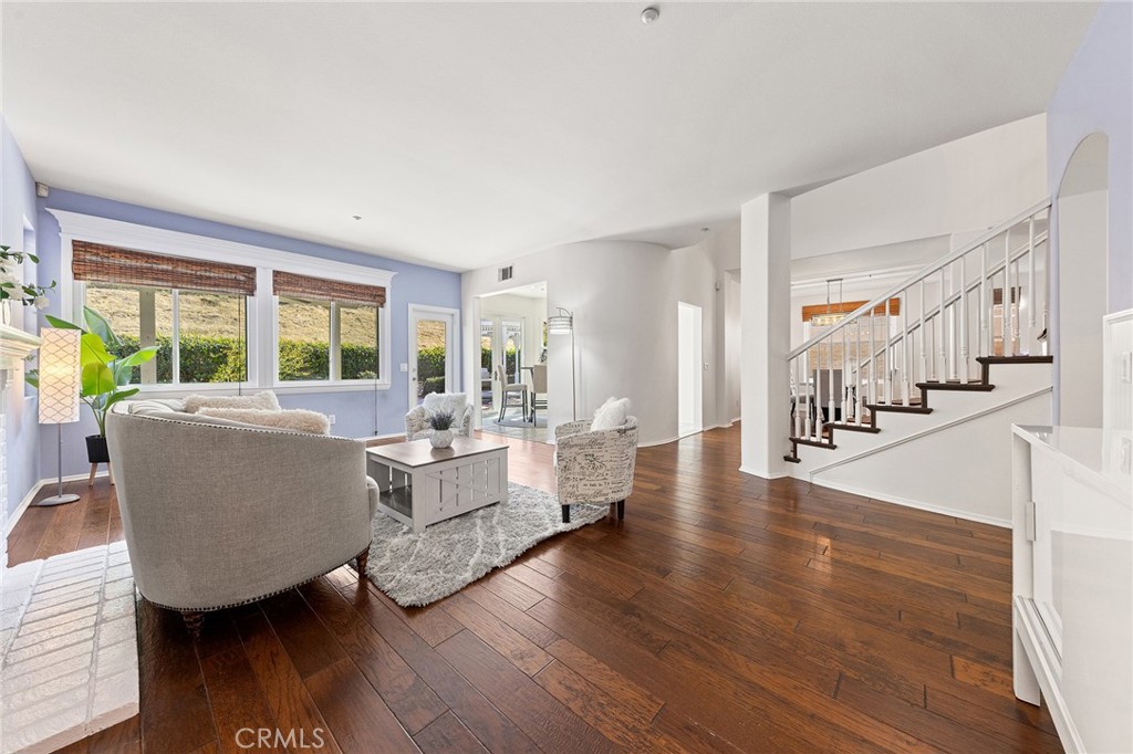6133 Natalie Road Chino Hills, CA 91709 - Photo 19 of 62 a living room with couches and a large window with wooden floor