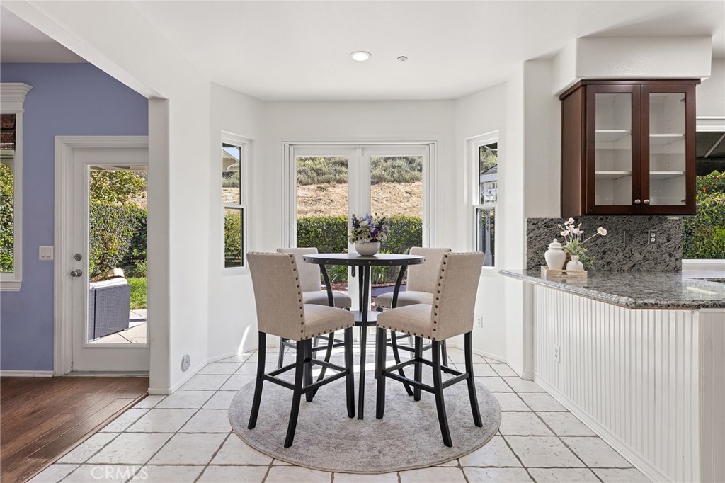 6133 Natalie Road Chino Hills, CA 91709 - Photo 22 of 62 a view of a dining room with furniture and window