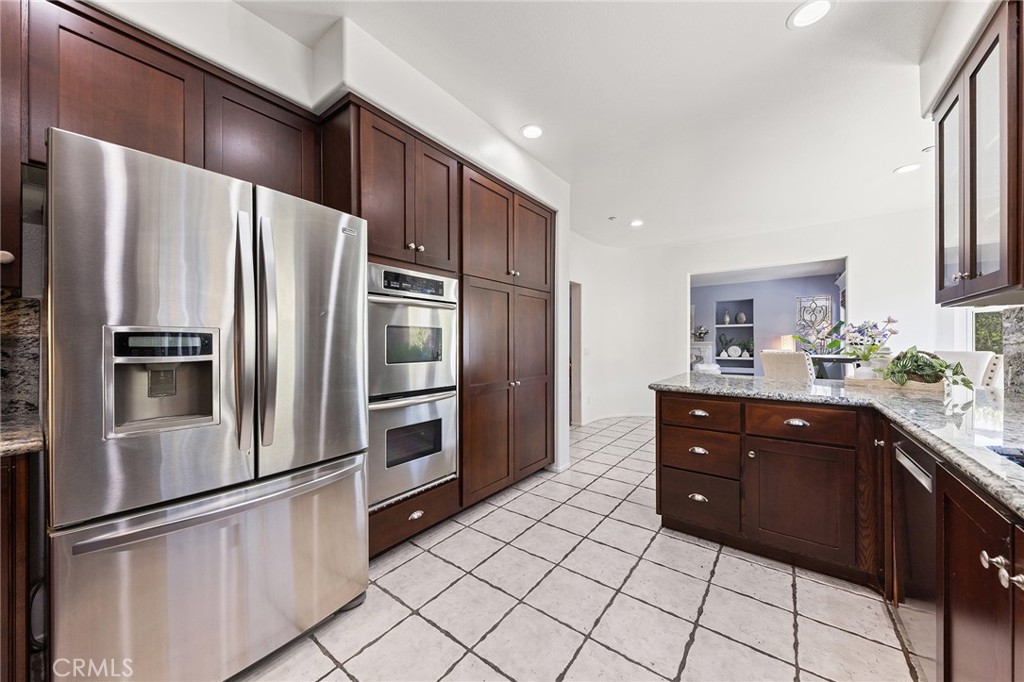 6133 Natalie Road Chino Hills, CA 91709 - Photo 27 of 62 a kitchen with stainless steel appliances a refrigerator and a sink