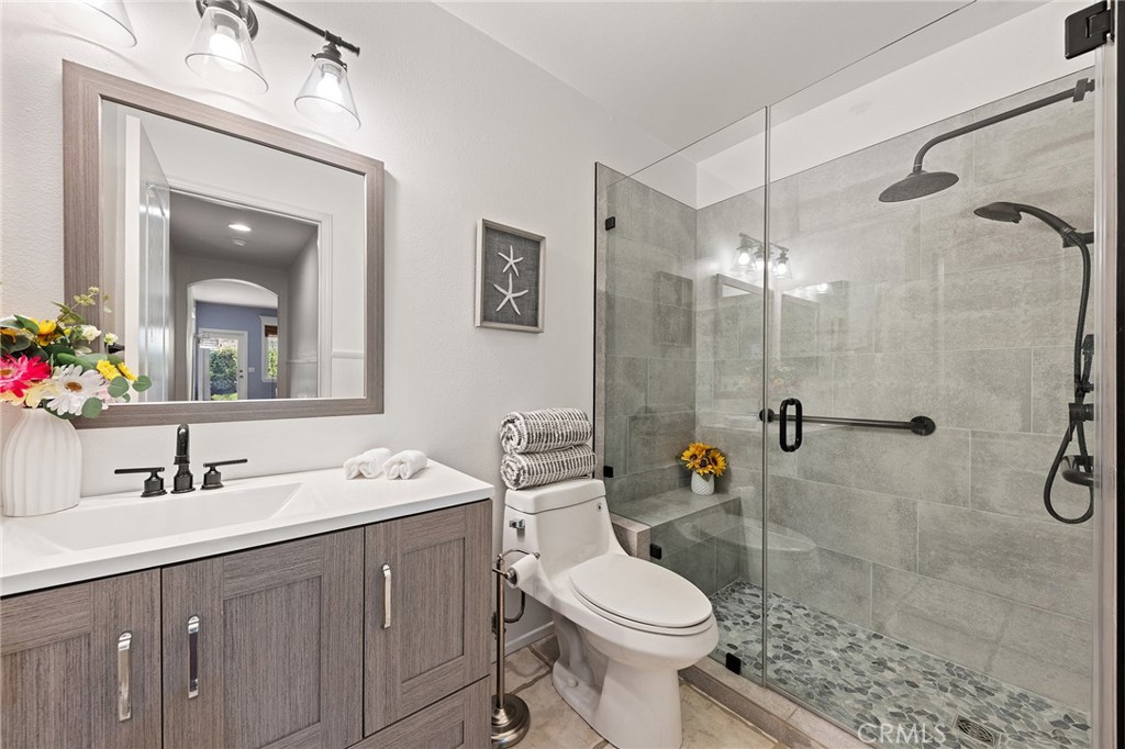 6133 Natalie Road Chino Hills, CA 91709 - Photo 28 of 62 a bathroom with a sink a toilet and shower