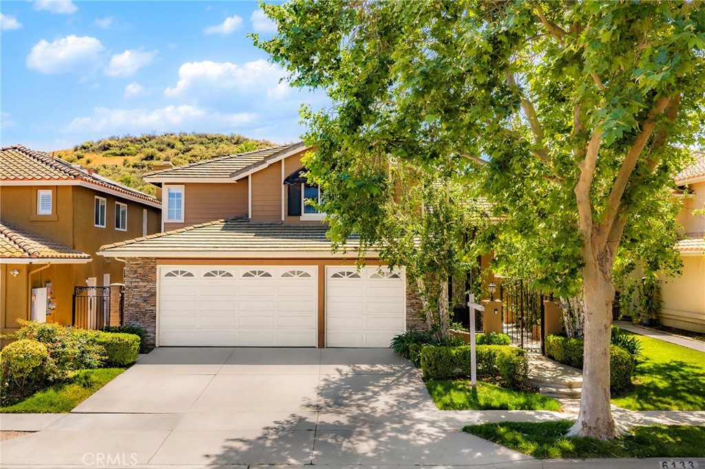 6133 Natalie Road Chino Hills, CA 91709 - Photo 3 of 62 a front view of a house with a yard and garage