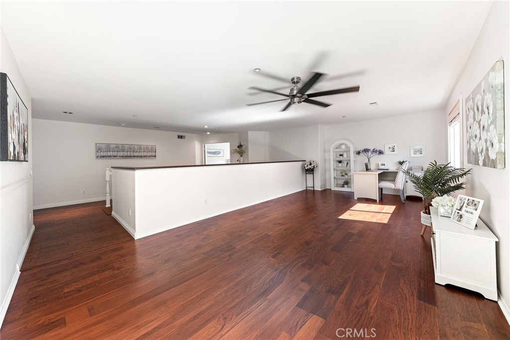 6133 Natalie Road Chino Hills, CA 91709 - Photo 32 of 62 a view of a living room and kitchen with wooden floor