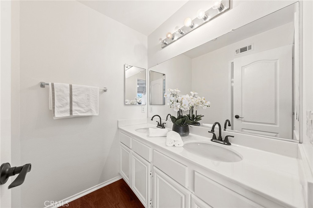 6133 Natalie Road Chino Hills, CA 91709 - Photo 41 of 62 a bathroom with a sink and a mirror