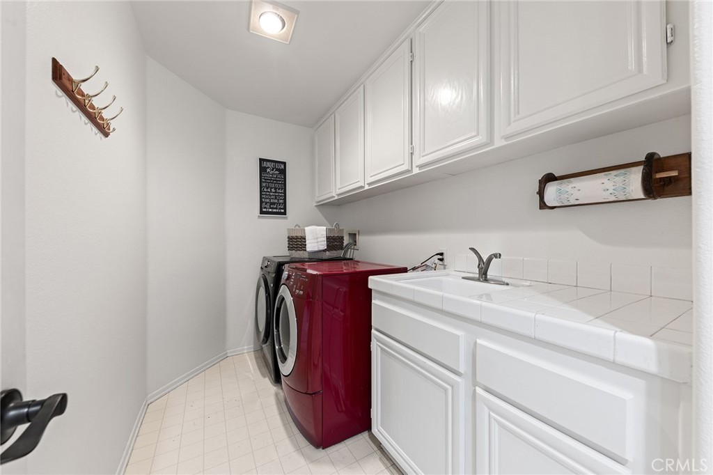 6133 Natalie Road Chino Hills, CA 91709 - Photo 47 of 62 a utility room with dryer and washer