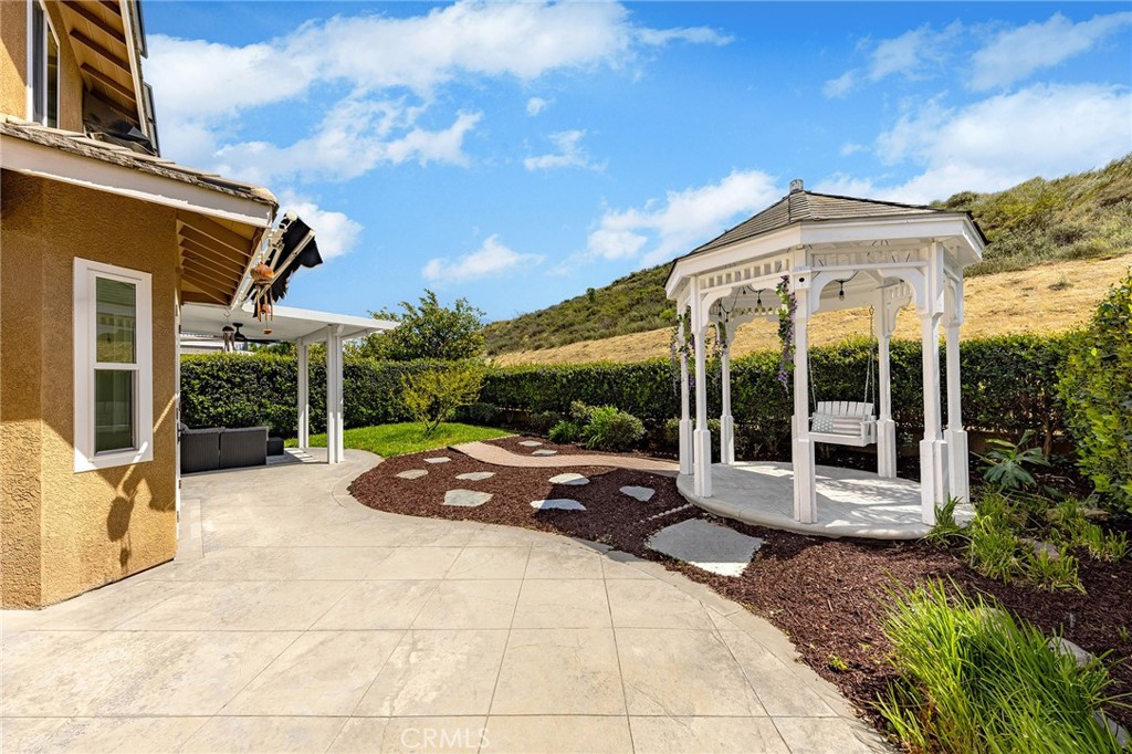 6133 Natalie Road Chino Hills, CA 91709 - Photo 51 of 62 a view of a house with backyard and porch