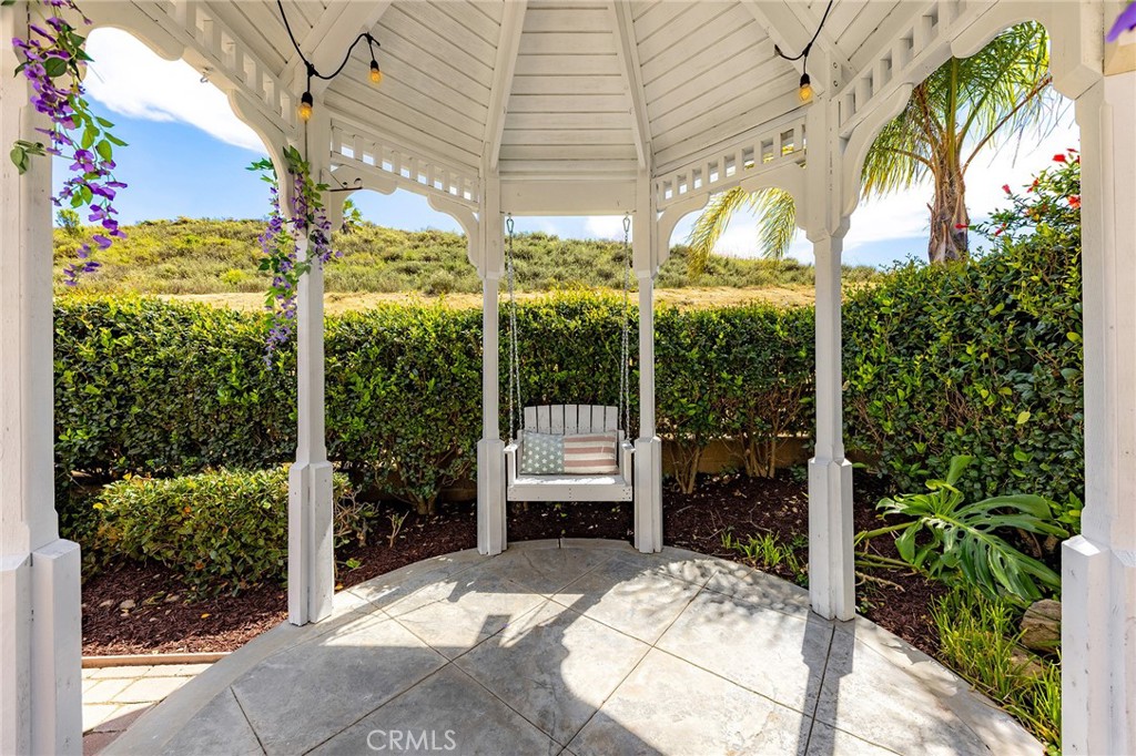 6133 Natalie Road Chino Hills, CA 91709 - Photo 54 of 62 a view of porch with a table and chairs and potted plants