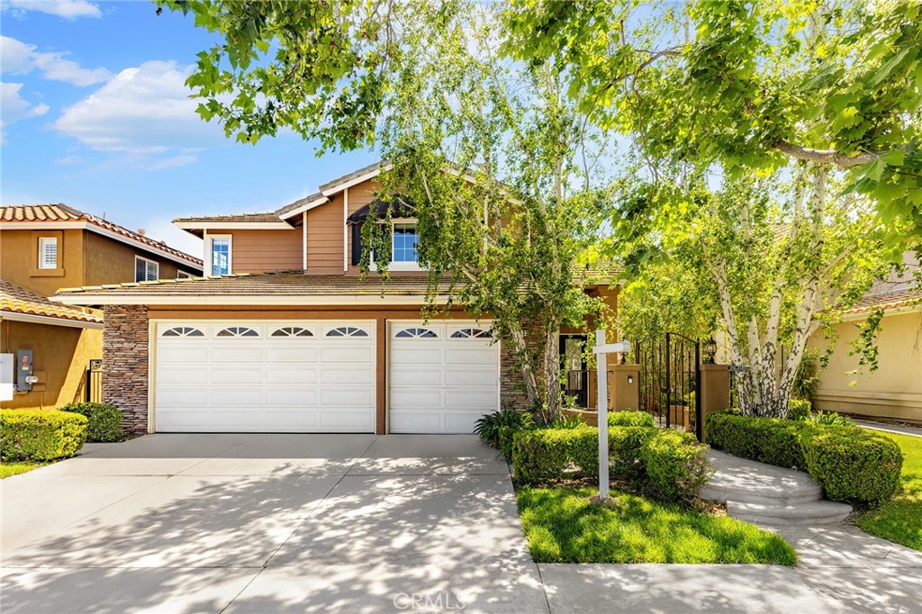 6133 Natalie Road Chino Hills, CA 91709 - Photo 6 of 62 a front view of a house with a garden