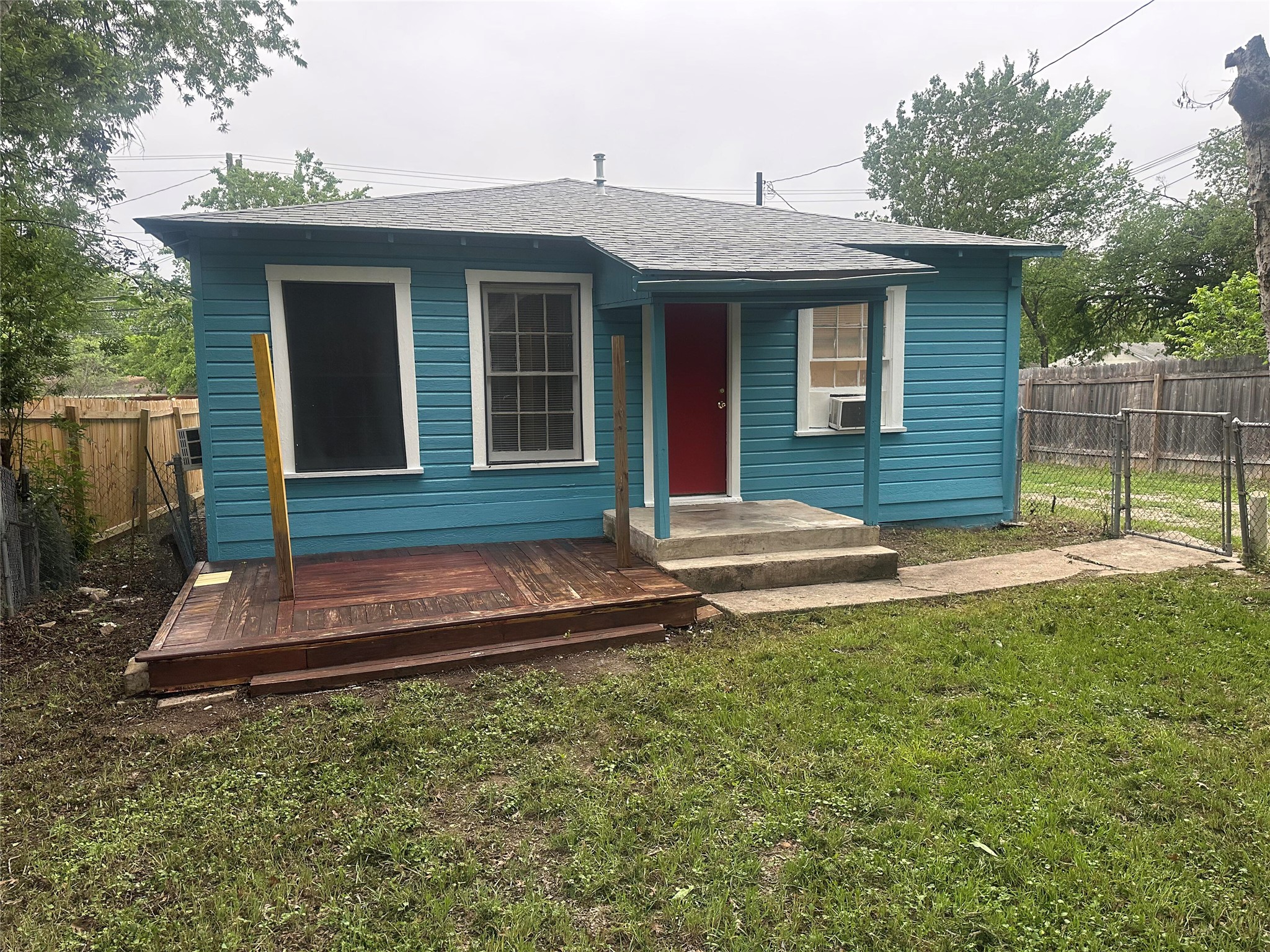 504 West St Johns Avenue, Unit A Austin, TX 78752 - Photo 15 of 17 a front view of a house with a yard