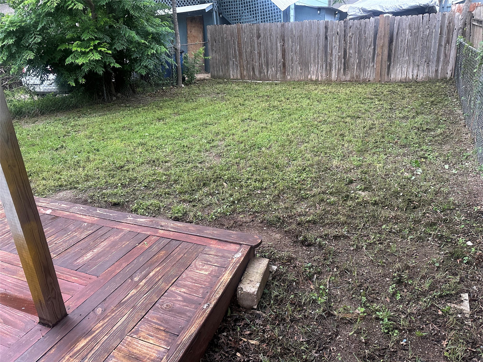 504 West St Johns Avenue, Unit A Austin, TX 78752 - Photo 16 of 17 a view of a backyard with large trees
