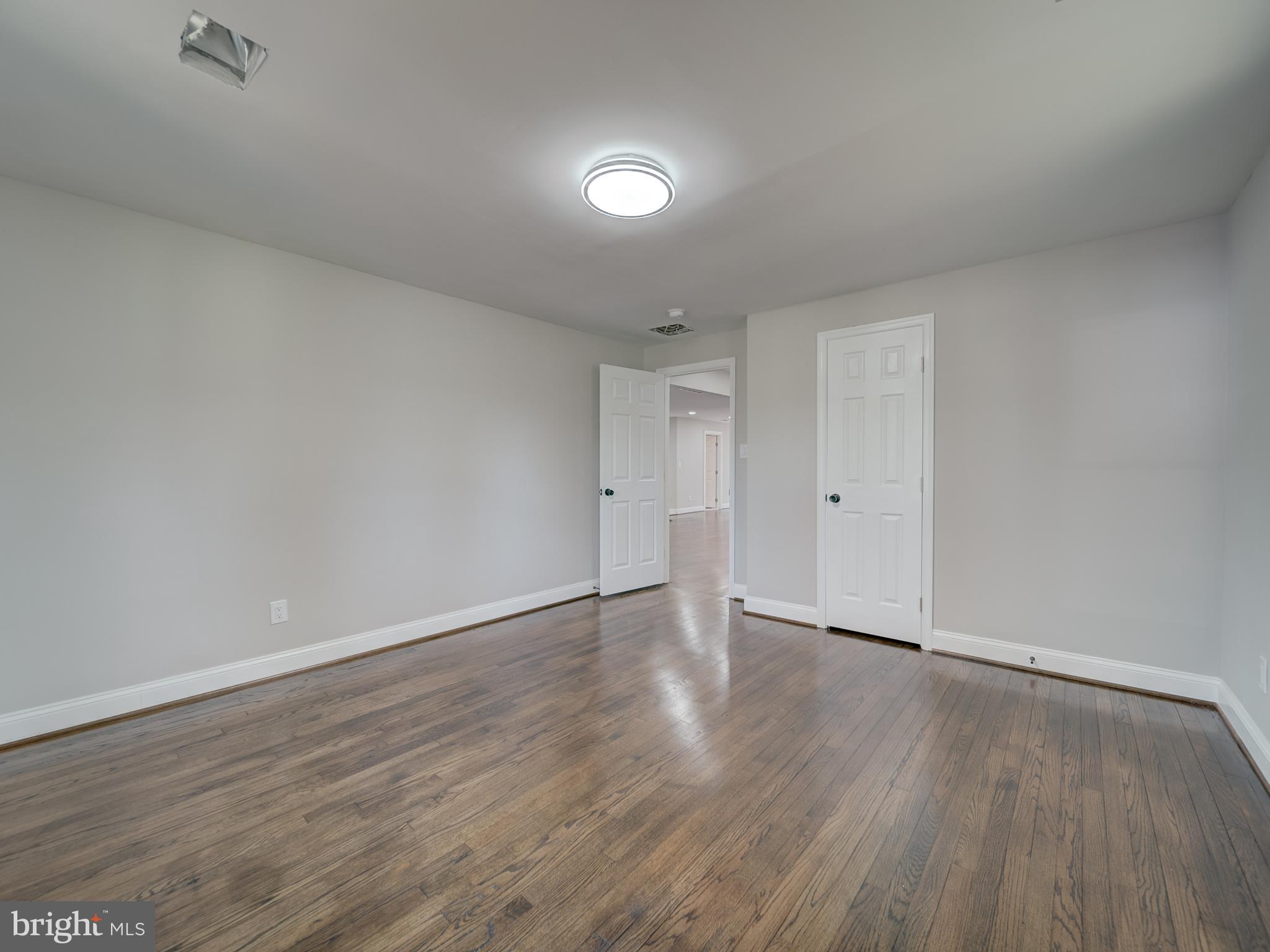 401 Bryan Point Road Accokeek, MD 20607 - Photo 14 of 48 a view of an empty room and wooden floor