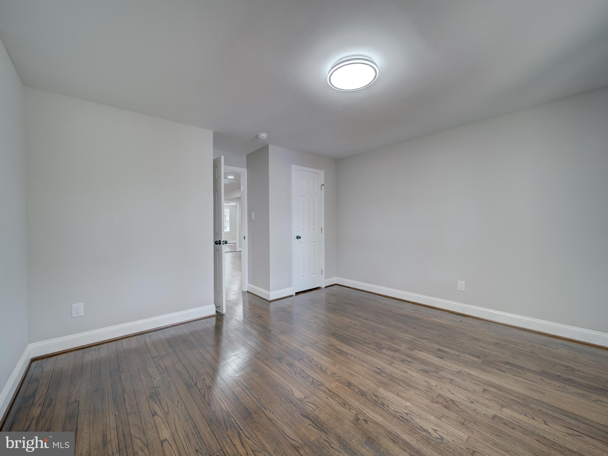 401 Bryan Point Road Accokeek, MD 20607 - Photo 18 of 48 a view of an empty room with wooden floor