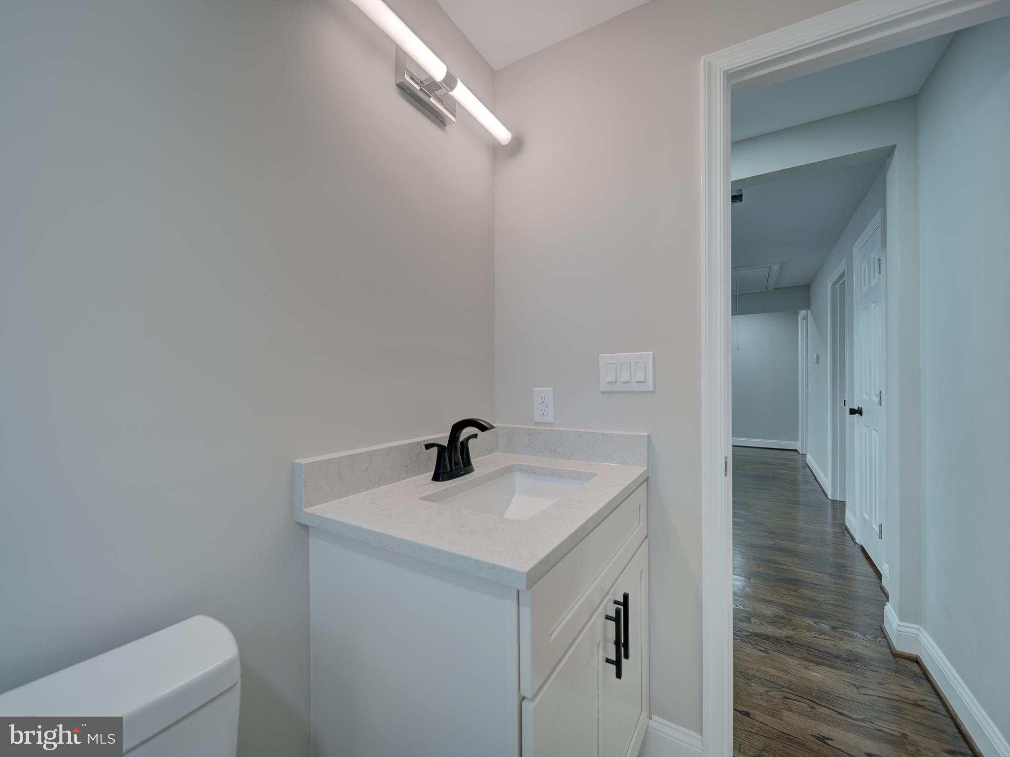 401 Bryan Point Road Accokeek, MD 20607 - Photo 21 of 48 a bathroom with a sink toilet and vanity
