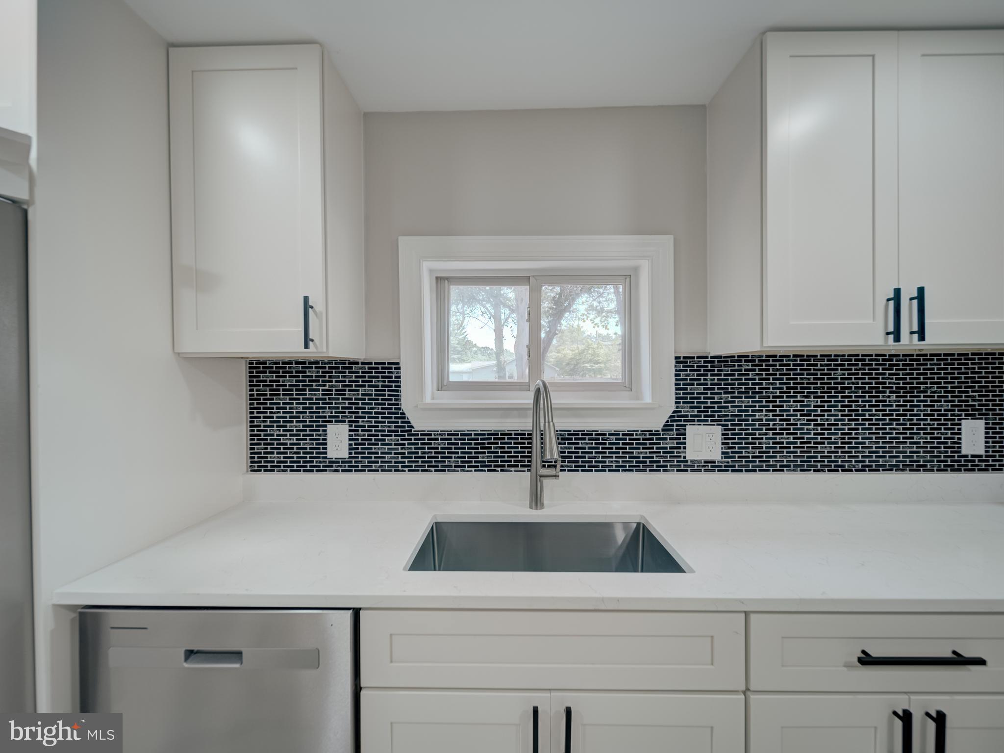 401 Bryan Point Road Accokeek, MD 20607 - Photo 26 of 48 a kitchen with a sink and cabinets