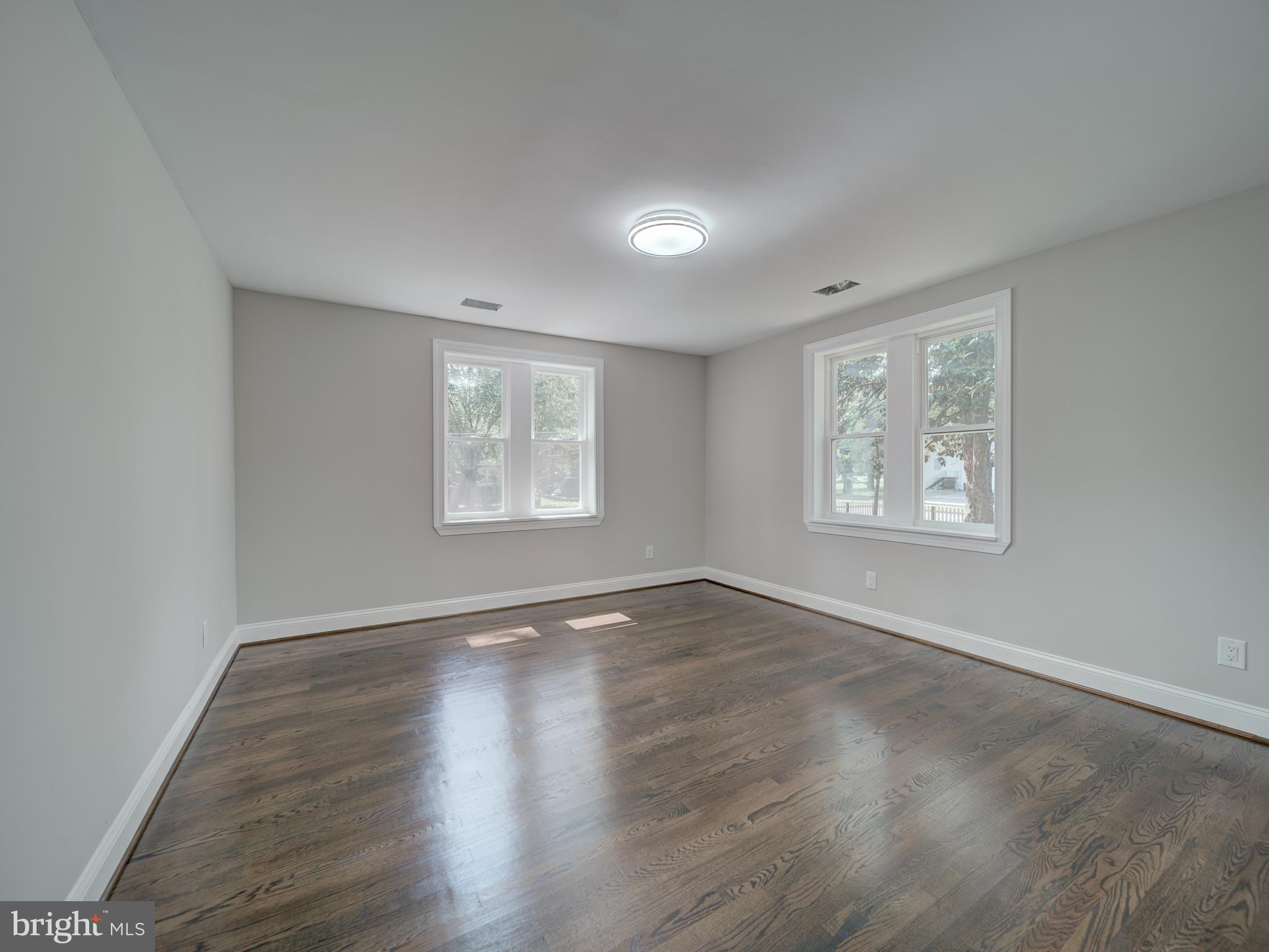 401 Bryan Point Road Accokeek, MD 20607 - Photo 29 of 48 a view of an empty room with wooden floor and a window