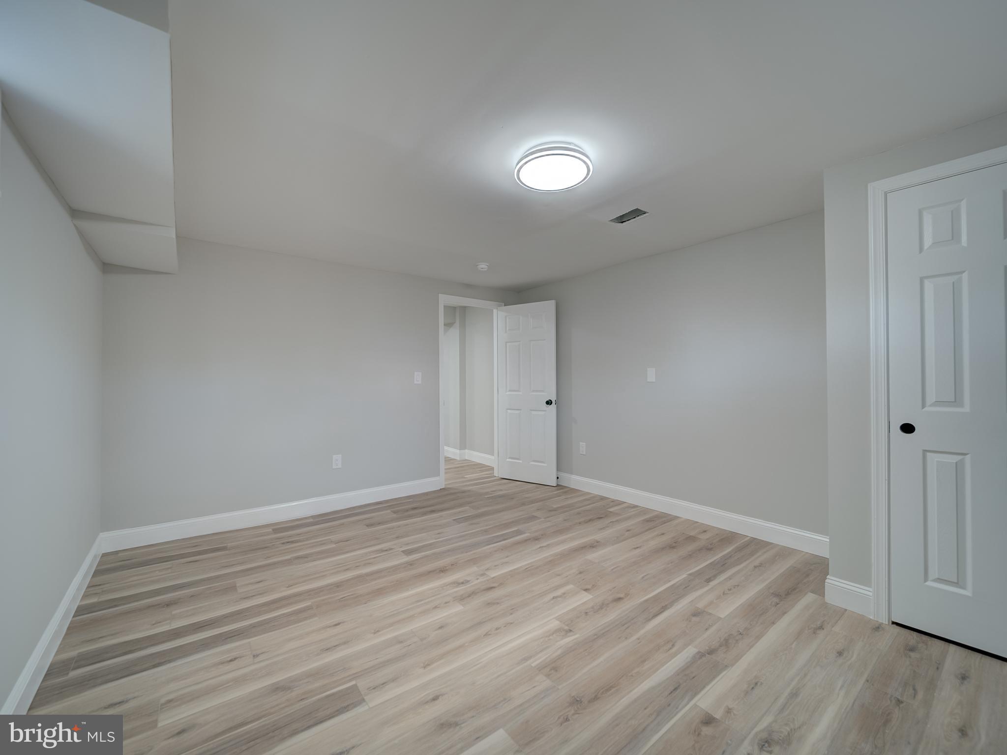 401 Bryan Point Road Accokeek, MD 20607 - Photo 40 of 48 wooden floor in an empty room