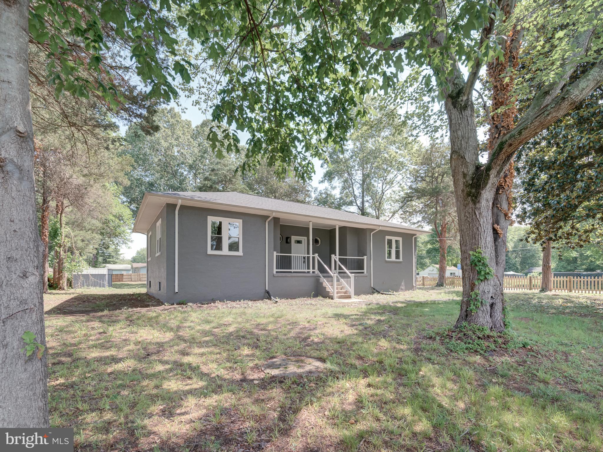 401 Bryan Point Road Accokeek, MD 20607 - Photo 4 of 48 a front view of house with yard and trees